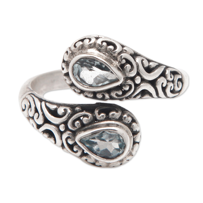 Blue topaz wrap ring, 'Two Delights' - Balinese 925 Silver Wrap Ring with Two Blue Topaz Gemstones