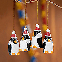 Wood ornaments, 'Christmas Penguins' (set of 4) - 4 Hand-Painted Wood Penguin Christmas Ornaments from Bali