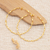 Gold-plated half-hoop earrings, 'Triumph Ribbons' - High-Polished 18k Gold-Plated Brass Half-Hoop Earrings