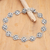 Sterling silver link bracelet, 'Flower Heart' - Polished Floral Sterling Silver Link Bracelet from Bali
