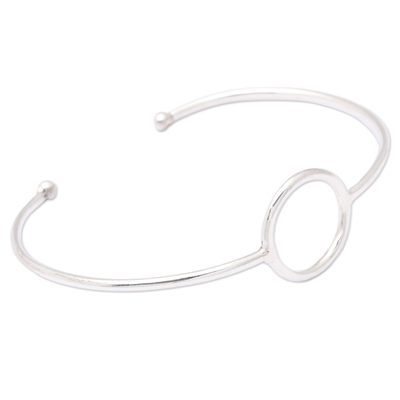 Sterling silver cuff bracelet, 'Globe-Trotting's Core' - Minimalist Round Accent Sterling Silver Cuff Bracelet