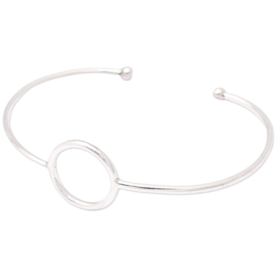 Sterling silver cuff bracelet, 'Globe-Trotting's Core' - Minimalist Round Accent Sterling Silver Cuff Bracelet