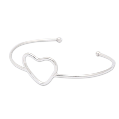 Sterling silver cuff bracelet, 'Globe-Trotting's Heart' - Minimalist Heart Symbol Sterling Silver Cuff Bracelet