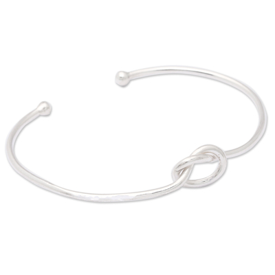 Sterling silver cuff bracelet, 'Twisted Directions' - High-Polished Minimalist Knot Sterling Silver Cuff Bracelet