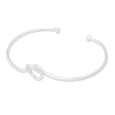 Sterling silver cuff bracelet, 'Twisted Directions' - High-Polished Minimalist Knot Sterling Silver Cuff Bracelet