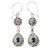 Pendientes colgantes de topacio azul - Pendientes colgantes de plata de ley con topacio azul y motivos de hojas