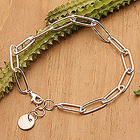 Sterling silver charm bracelet, 'United Luck' - High-Polished Modern Sterling Silver Charm Bracelet