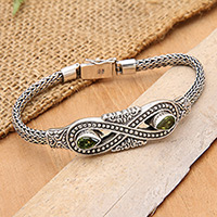 Peridot pendant bracelet, 'Green Infinity' - Silver Peridot Pendant Bracelet with Infinity Symbol Motif