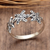 Sterling silver band ring, 'Starry Blooms' - Star-Inspired Floral Sterling Silver Band Ring from Bali