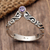 Amethyst single stone ring, 'Crown Enchantment' - Faceted Amethyst Single Stone Ring with Balinese Motifs