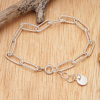 Sterling silver charm bracelet, 'United Luck & Ropes' - High-Polished Modern Rope Sterling Silver Charm Bracelet