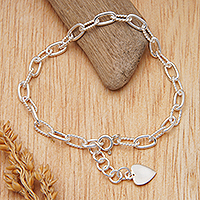 Sterling silver charm bracelet, 'Interconnected Heart' - Modern Rope Sterling Silver Bracelet with Heart Charm