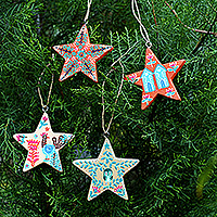 Wood ornaments, 'Starry Holidays' (set of 4) - Set of 4 Hand-Painted Star-Shaped Albesia Wood Ornaments