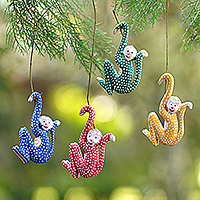 Wood ornaments, 'Jumping Monkeys' (set of 4) - Set of 4 Painted Tropical Albesia Wood Monkey Ornaments