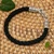 Sterling silver pendant bracelet, 'Hero of Islands' - Balinese Artisan-Made Black Sterling Silver Pendant Bracelet