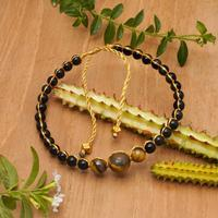 Onyx and tiger's eye beaded bracelet, 'Power of Earth' - Adjustable Onyx and Tiger's Eye Beaded Bracelet from Bali