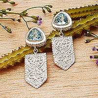 Blue topaz dangle earrings, 'Loyal Emblem' - Regal Spring-Themed Seven-Carat Blue Topaz Dangle Earrings