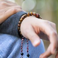 Men's multi-gemstone beaded pendant bracelet, 'Tridatu Protection' - Yoga Tridatu Men's Onyx Tiger's Eye Unakite Pendant Bracelet