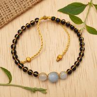 Onyx and aquamarine beaded bracelet, 'Peace in Darkness' - Balinese-Crafted Golden Onyx and Aquamarine Beaded Bracelet