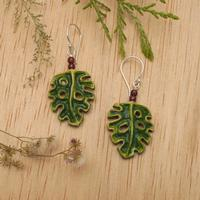 Garnet dangle earrings, 'Tropical Monstera' - Hand-Painted and Carved Garnet Silver Leaf Dangle Earrings