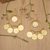 Gold-plated chandelier earrings, 'Moon Dame' - Balinese-Made Folk Art 18k Gold-Plated Chandelier Earrings (image 2) thumbail