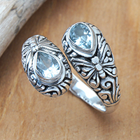 Blue topaz wrap ring, 'Bonds of Loyalty' - Balinese-Inspired Sterling Silver and Blue Topaz Wrap Ring