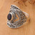 Garnet cocktail ring, 'Eye for Passion' - Balinese-Made Folk Art One-Carat Oval Garnet Cocktail Ring