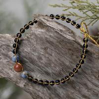 Onyx and sodalite beaded bracelet, 'Mysterious Mind' - Onyx and Sodalite Beaded Bracelet with Golden Brass Accents