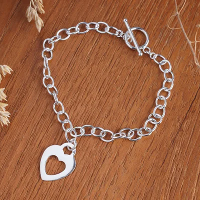 Sterling silver pendant bracelet, 'Everlasting Loving' - Sterling Silver Pendant Bracelet with Hollow Heart Motif