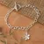 Sterling silver pendant bracelet, 'Snowy Jasmine' - Sterling Silver Bracelet with Jasmine-Shaped Pendant