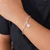 Sterling silver pendant bracelet, 'Snowy Jasmine' - Sterling Silver Bracelet with Jasmine-Shaped Pendant