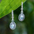 Gold-accented blue topaz dangle earrings, 'Floral Peace' - Spring-Themed 1-Carat Blue Topaz Flower Dangle Earrings