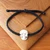 Cotton braided pendant bracelet, 'Hades Bonds' - Inspirational Unisex Black Cotton Skull Pendant Bracelet