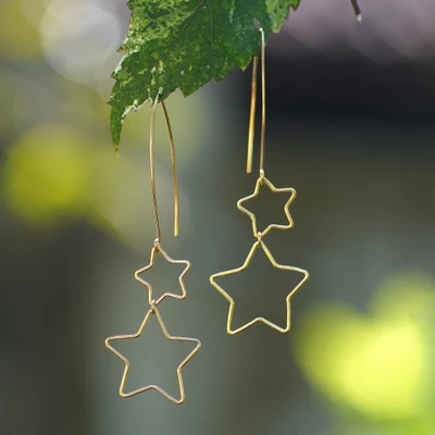 Gold-plated dangle earrings, 'Stars at Midnight' - Interlinked Hollow Star-Themed Gold-Plated Dangle Earrings