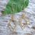 Gold-plated dangle earrings, 'Intertwined Geometry' - Geometric-Inspired 18k Gold-Plated Brass Dangle Earrings