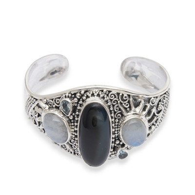 Multi-gemstone cuff bracelet, 'Sun and Moon Luxury' - Sun-Themed Onyx Rainbow Moonstone Blue Topaz Cuff Bracelet
