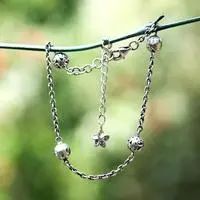 Sterling silver station bracelet, 'Hammered Swirling Garden' - Silver Station Bracelet with Hammered and Swirl Orb Motifs