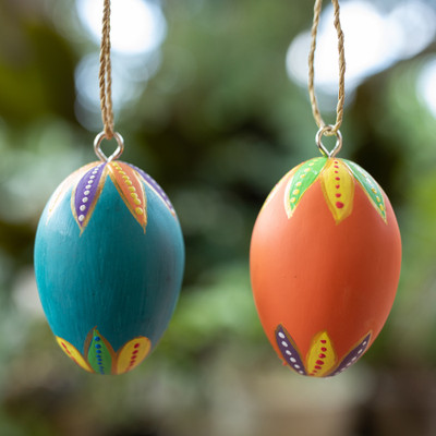 Wood ornaments, 'Colorful Holiday Eggs' (pair) - 2 Colorful Hand-Carved Painted Wood Egg Christmas Ornaments