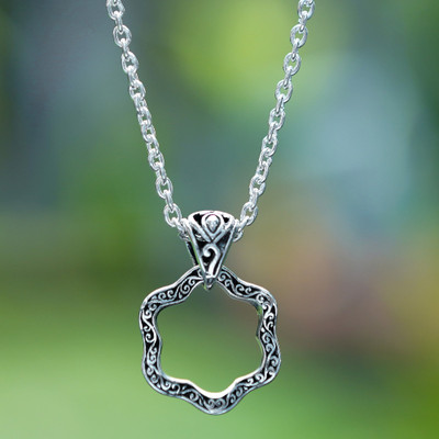 Sterling silver pendant necklace, 'Petals from Gianyar' - Artisan-Made Floral Oxidized and Polished Pendant Necklace