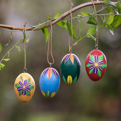 Wood ornaments, 'Festive Eggs' (set of 4) - Egg-Shaped Hand-Painted Wood Christmas Ornaments (Set of 4)