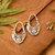 Sterling silver hoop earrings, 'Blooming Lotus' - Lotus Flower-Themed Textured Sterling Silver Hoop Earrings (image 2) thumbail