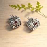 Gold-accented blue topaz hoop earrings, 'Seductive Garden' - Spring-Themed Hoop Earrings with Garnet and 18k Gold Accents