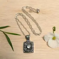 Blue topaz pendant necklace, 'Spring in Paradise' - Spring-Themed Oxidized Faceted Blue Topaz Pendant Necklace