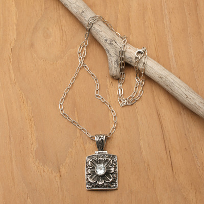Blue topaz pendant necklace, 'Spring in Paradise' - Spring-Themed Oxidized Faceted Blue Topaz Pendant Necklace