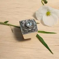 Blue topaz cocktail ring, 'Spring in Paradise' - Oxidized and Polished Floral Round Blue Topaz Cocktail Ring