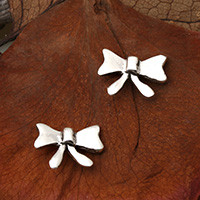 Sterling silver stud earrings, 'Ribbon of Love' - Whimsical Ribbon Bow-Shaped Sterling Silver Stud Earrings