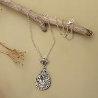 Blue topaz pendant necklace, 'Lotus Blooms' - Blue Topaz Silver Pendant Necklace with Floral Leaf Motifs