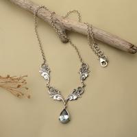 Blue topaz pendant necklace, 'Garden of Devotion' - 6.5-Carat Blue Topaz Silver Pendant Necklace with Leaf Motif