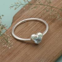 Blue topaz band ring, 'United by Love' - Heart-Themed Blue Topaz Sterling Silver Band from Java