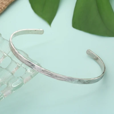 Sterling silver cuff bracelet, 'Flowing with the Current' - Minimalist Modern Textured Sterling Silver Cuff Bracelet